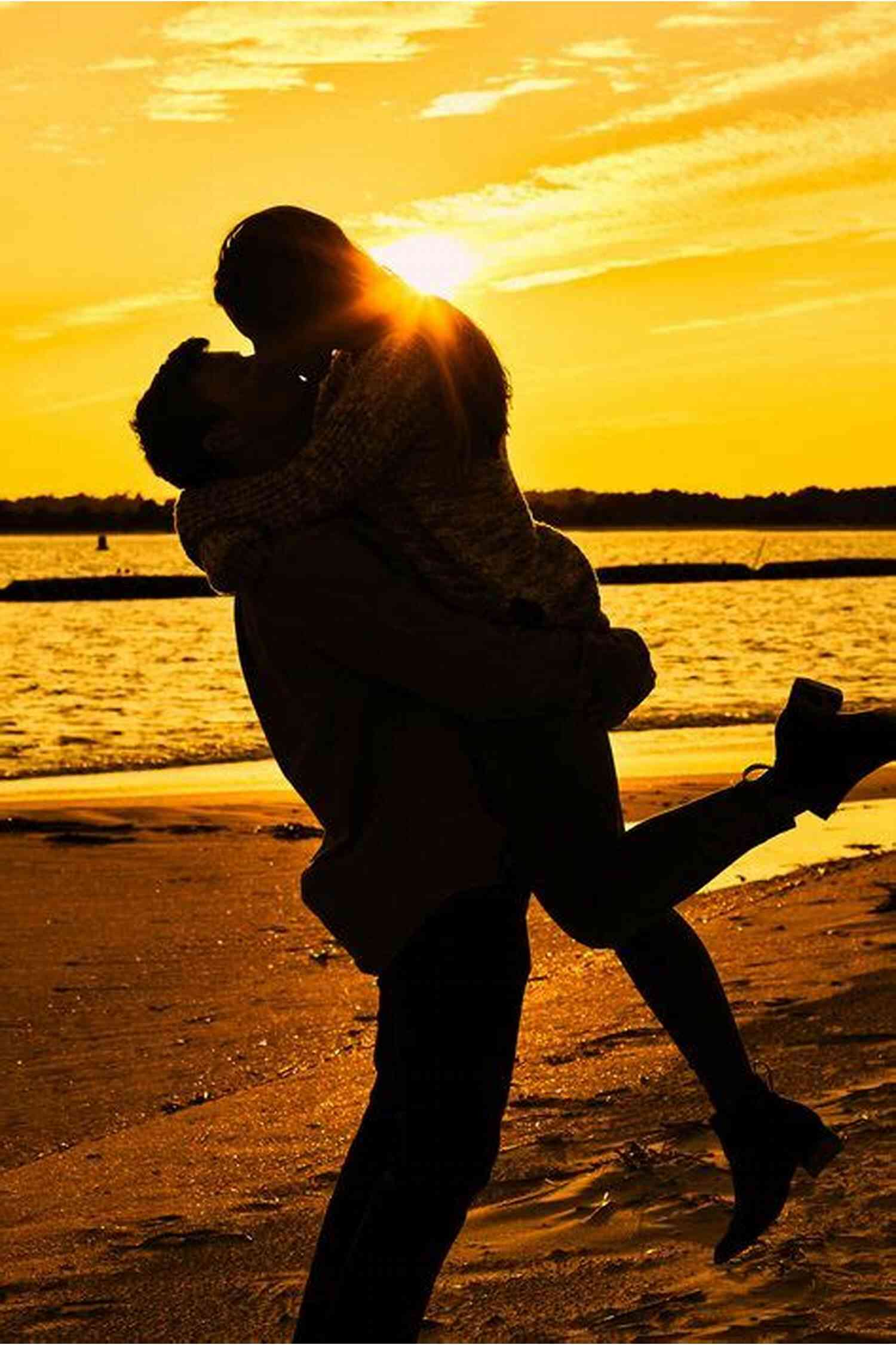Couple Cuddling And Watching A Beautiful Sunset 101 Romantic Text Messages For Your Girlfriend