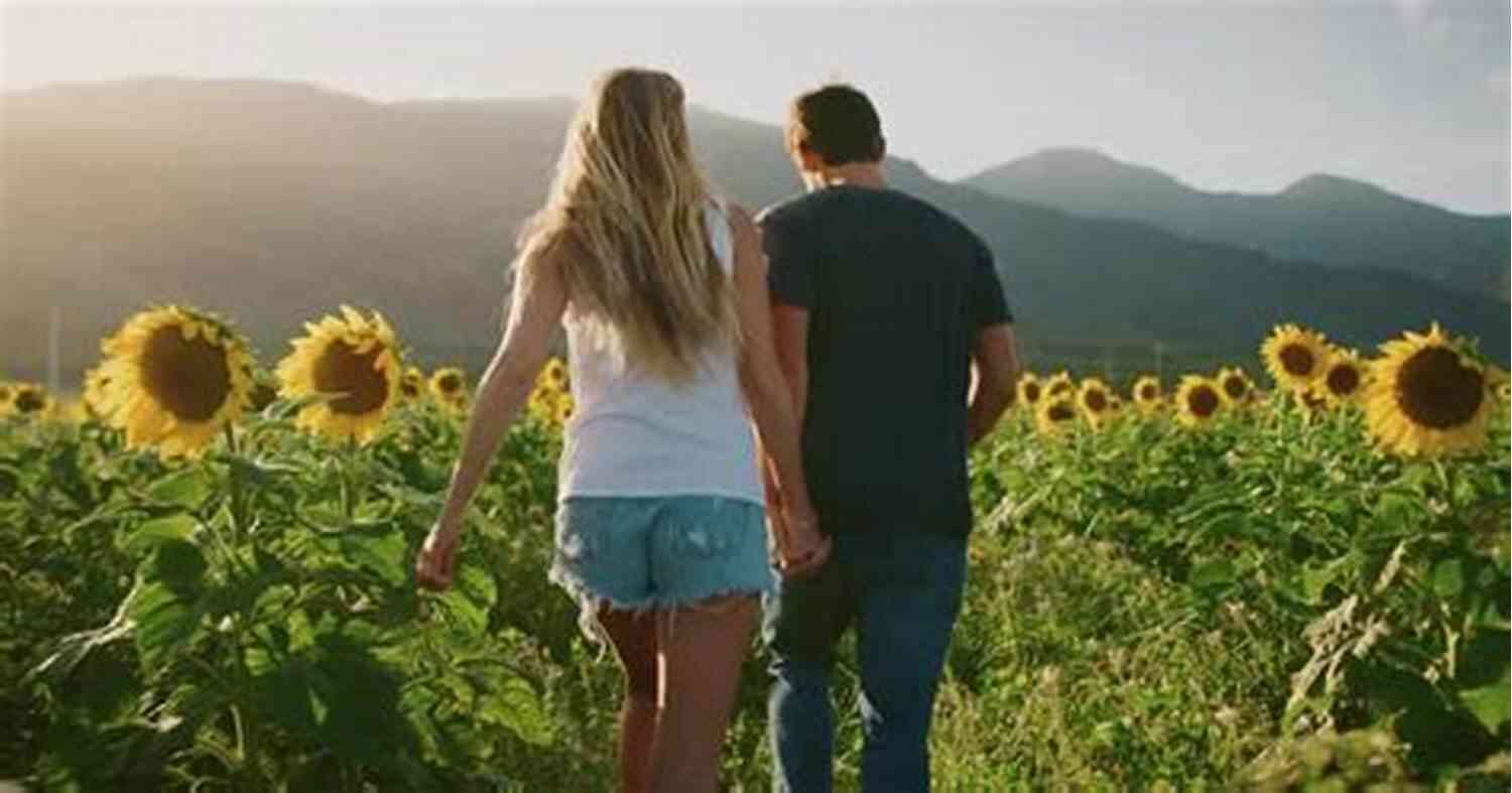Couple Dancing Joyfully In A Vibrant Field Of Flowers 101 Romantic Text Messages For Your Girlfriend