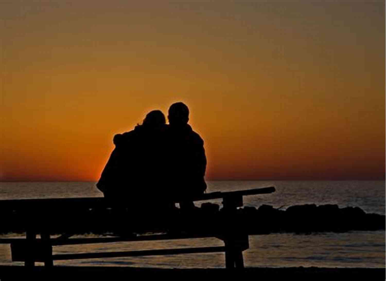 Couple Sitting On A Beach And Watching A Breathtaking Sunset 101 Romantic Text Messages For Your Girlfriend