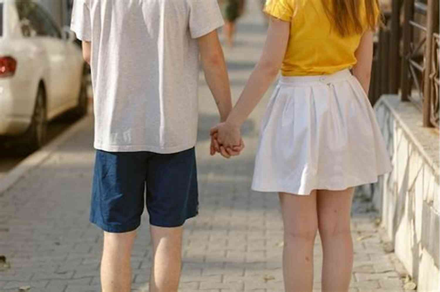 Couple Walking Hand In Hand On A Picturesque Bridge 101 Romantic Text Messages For Your Girlfriend