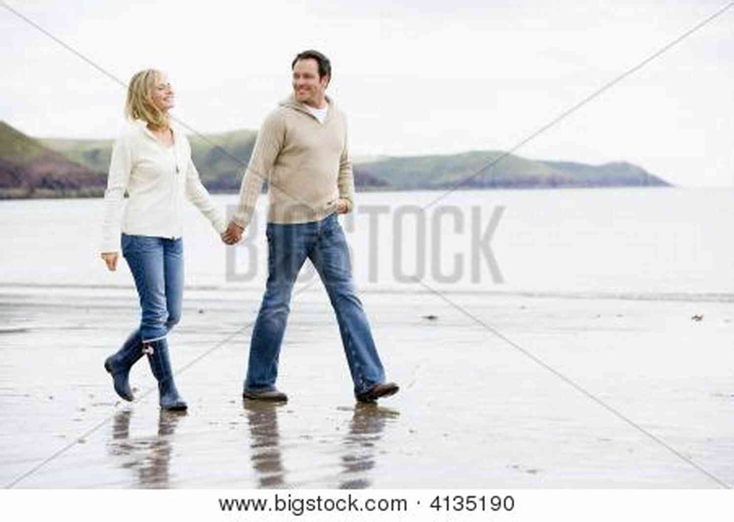 Couple Walking On The Beach During A Serene Sunrise 101 Romantic Text Messages For Your Girlfriend