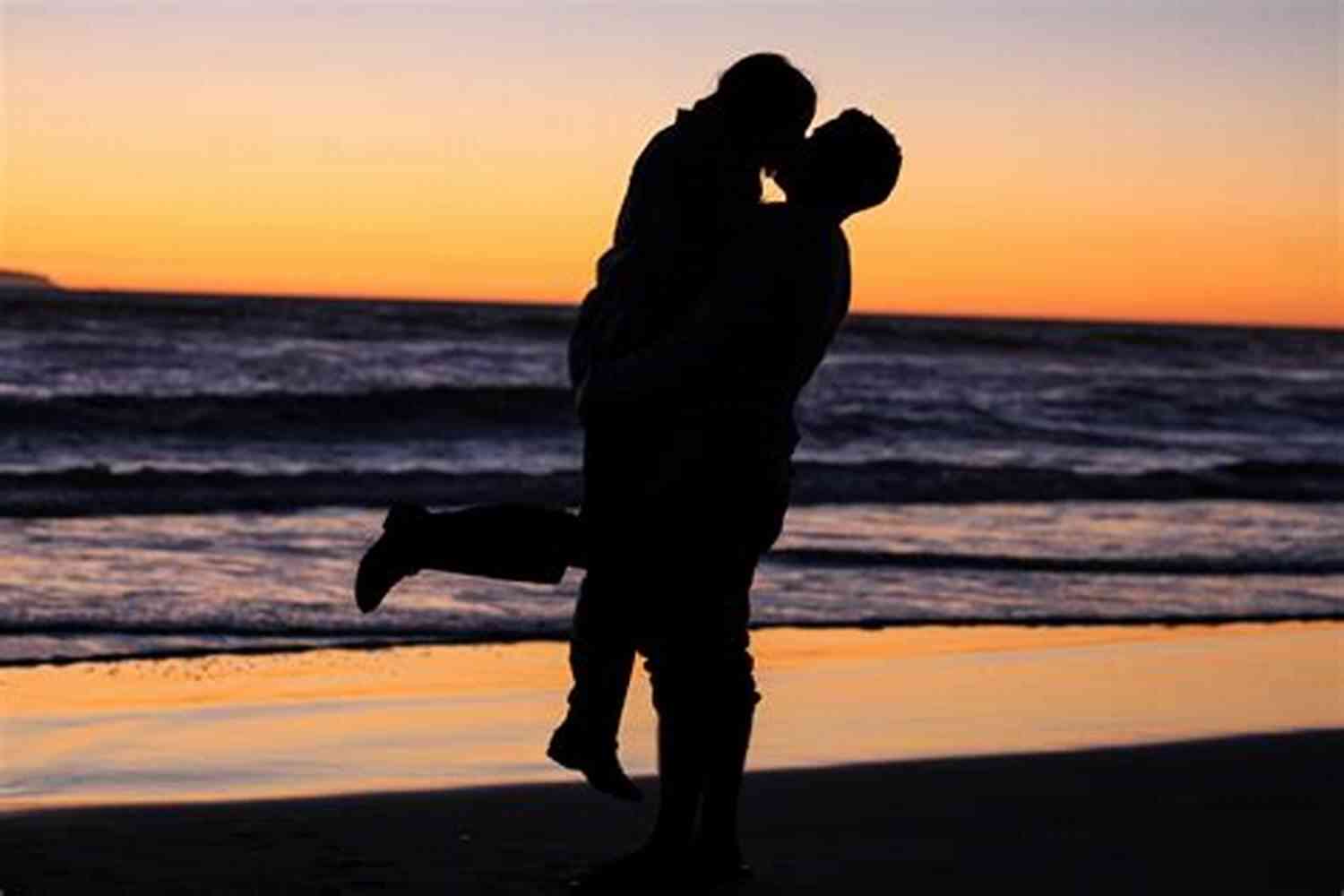 Happy Couple Embracing Against A Stunning Sunrise Wake Up To Romance 101 Romantic Text Messages For Your Girlfriend